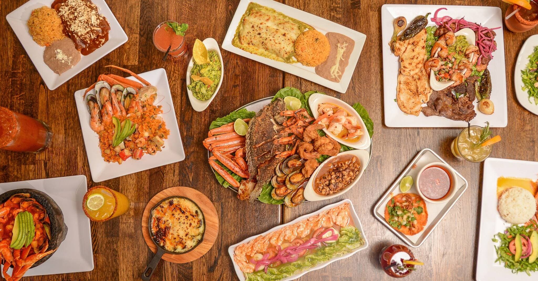 Agave Mexican Restaurant signature dishes platter with tacos, guacamole, and fresh salsas